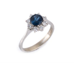 White gold ring with diamond and sapphire