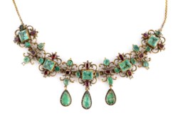 Gold necklace with emeralds and ruby roots