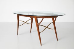 Sculptural table with brass inserts