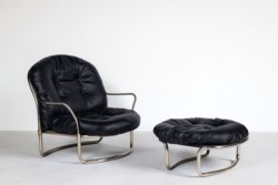 Set consisting of armchair mod. 915 with footstool